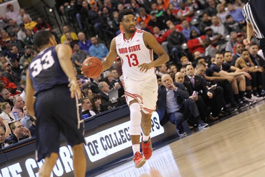 OSU guard JaQuan Lyle (13) leads the offense in the Big Ten tournament against Penn State on March 10 in Indianapolis. Credit: Lantern File Photo