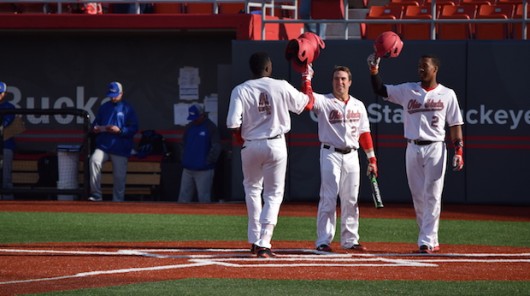 OSU junior left fielder Ronnie Dawson (4) is greeted at home plate after a three-run homer during a 12-1 win over Hofstra on March 18 at Bill Davis Stadium. Credit: Giustino Bovenzi | Lantern reporter