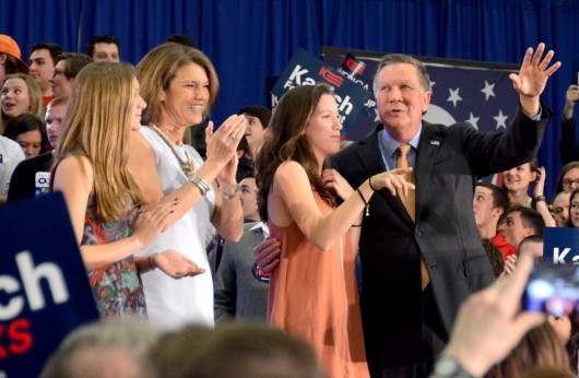 Ohio Gov. John Kasich (right), accompanied by his family, waves to the crowd at Baldwin Wallace University after winning Ohio's Republican primary on March 15. Credit: Kevin Stankiewicz | Asst. Sports Editor 