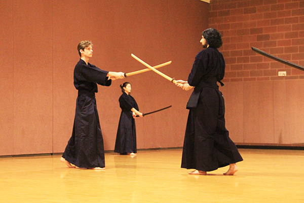 Cole Judge (left) and Justin Angra practice the different movements of kendo while at practice in the RPAC on February 25th, 2016.