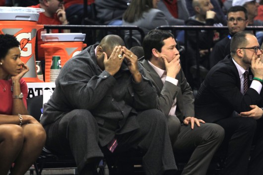 Ohio State coaches Mark Mitchell (left) and Kevin McGuff (right) watch OSU's 82-63 loss to Michigan State in the Big Ten tournament. Credit: Kevin Stankiewicz | Asst. Sports Editor