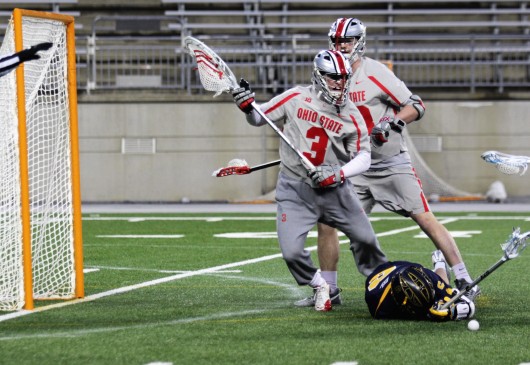 OSU redshirt junior goalie Tom Carey (3) tries to recover a ground ball during a game against Marquette on March 4 at Ohio Stadium. Credit: Jenna Leinasars | Multimedia Editor 