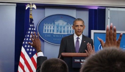 Collegiate reporters raise their hands to ask President Barack Obama questions in the White House's James S. Brady Press Briefing Room on College Reporter Day, April 28.