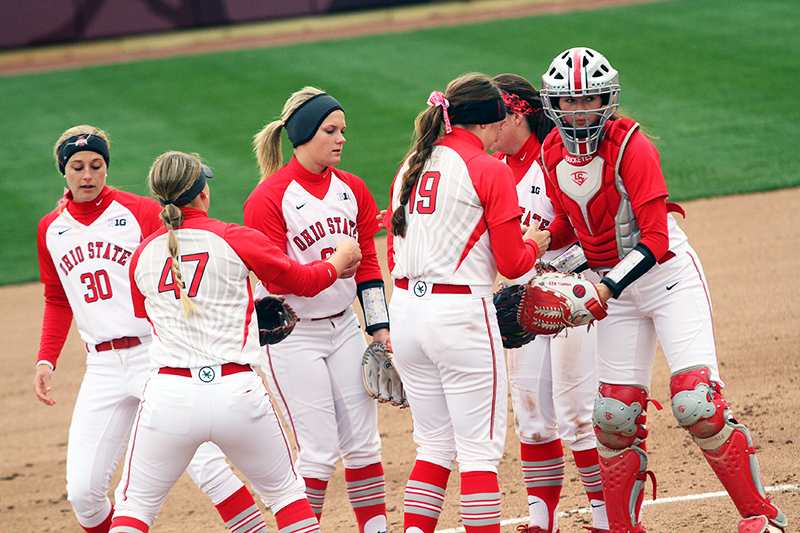 OSU softball players during a game against Penn State on April 6 at Buckeye Field. Credit: Samantha Hollingshead | Photo Editor 