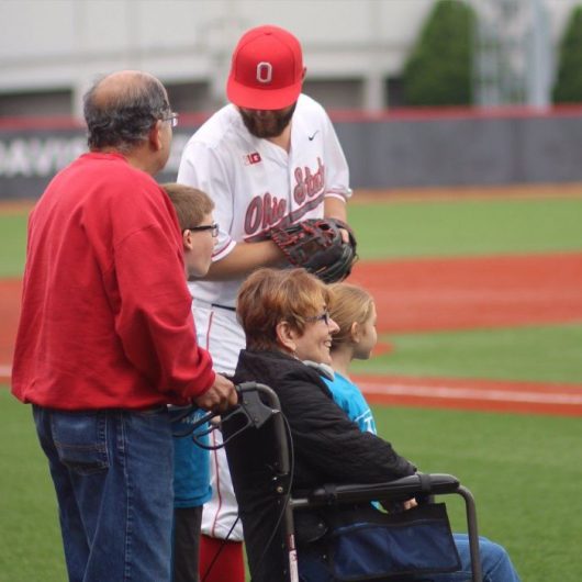 Jake Brobst (14) greets the Martinez family on May 3, ALS Awareness night at Bill Davis Stadium. Courtesy: OSU Athletics