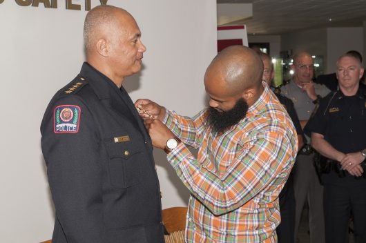 Craig Stone's son pins a medal on his father during a ceremony for the newly minted chief of the Ohio State Division of Police. Stone became the chief of police in May, and the pinning ceremony was held on Tuesday, June 7.