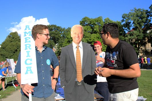 Third-year Vice President of Ohio State College Democrats Levi Griffith (left) stands with other club members and a Joe Biden standee at the Involvement Fair on Aug. 21. Credit: Alexa Mavrogianis | Photo Editor