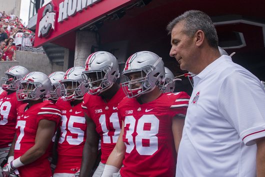 Ohio State coach Urban Meyer and the Buckeyes wait by the tunnel before the start of OSU’s game against Tulsa on Sept. 10. Credit: Alexa Mavrogianis | Photo Editor