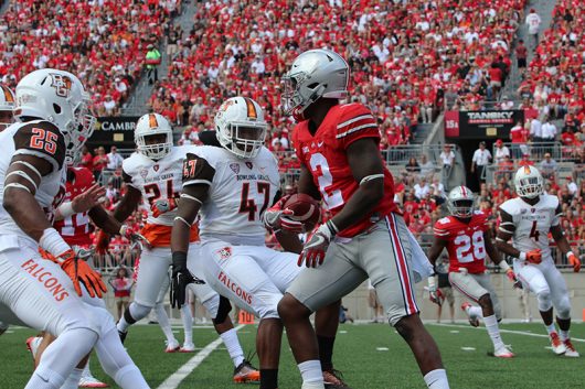 Bowling Green players surround OSU senior wide receiver Dontre Wilson (2) after a fair catch during the first half of the Buckeyes’ season opener against Bowling Green on Sept. 3 at Ohio Stadium. The Buckeyes won 77-10. Credit: Alexa Mavrogianis | Photo Editor