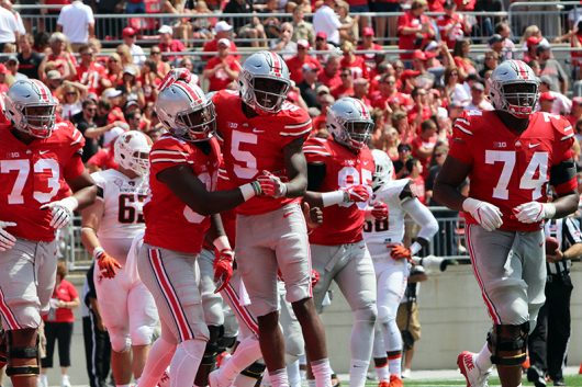 OSU sophomore wide receiver Noah Brown (80) celebrates his first half touchdown with OSU fifth-year wide receiver Corey Smith (5) during the first game of the 2016 season against Bowling Green on Sept. 3 at Ohio Stadium. The Buckeyes won 77-10. Credit: Alexa Mavrogianis | Photo Editor