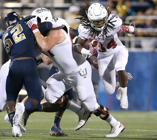 Indiana junior running back Devine Redding (34) runs in the first quarter against Florida International at Ocean Bank Field at FIU Stadium in Miami on Sept. 1. Indiana won, 34-13. Courtesy of TNS
