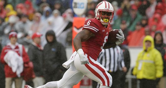 Wisconsin then-junior running back Corey Clement carries the ball en route to a 21-yard for touchdown during the second quarter against Rutgers on Saturday, Oct. 31, 2015, at Camp Randall Stadium in Madison, Wis. The host Badgers won, 48-10. Courtesy of TNS