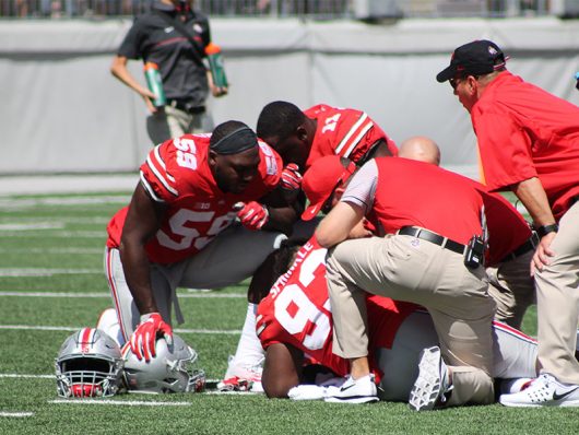  Tracy Sprinkle (93) lays on the field with a leg injury. He left the game following his injury during the first game of the 2016 season against Bowling Green on Sept. 3 in Ohio Stadium. The Buckeyes won 77-10. Credit: Mason Swires | Assistant Photo Editor 