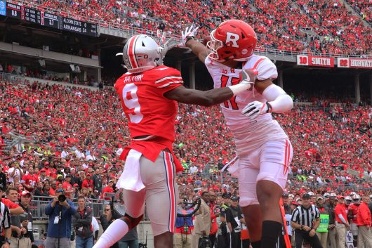 OSU freshman wide receiver Binjimen Victor (9) has the ball swatted away by Rutgers redshirt sophomore defensive back Isaiah Wharton (11) during the first half of the Buckeyes game against Rutgers on Oct. 1. The Buckeyes won 58-0. Credit: Alexa Mavrogianis | Photo Editor