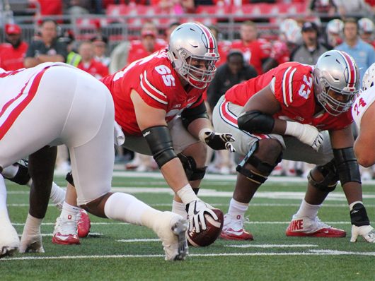 OSU center Pat Elflein (65) looks across the line of scrimmage during the second half against Indiana on Oct. 8. The Buckeyes won 38-17. Credit: Mason Swires | Assistant Photo Editor