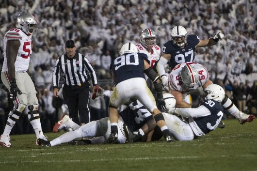 The Penn State defense tackles OSU redshirt junior quarterback J.T. Barrett late in the fourth quarter to solidify a 24-21 victory over the Buckeyes on Oct. 22. Credit: Alexa Mavrogianis | Photo Editor