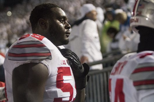 OSU sophomore offensive lineman Isaiah Prince (59) fights back tears after the Buckeyes 24-21 loss to Penn State on Oct. 22. Credit: Alexa Mavrogianis | Photo Editor