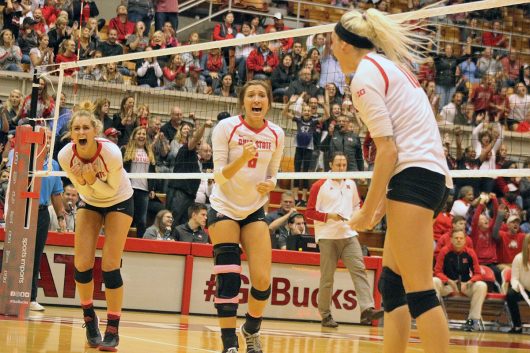 Players of the Ohio State women's volleyball team celebrate a team point during a game against Nebraska on Oct. 14. OSU lost, 3-1. Credit: Alexa Mavrogianis | Photo Editor
