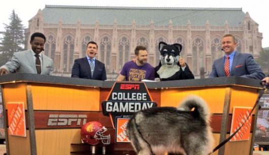 The College GameDay crew at the Washington-USC game on Nov. 12. Desmond Howard (far left) and Kirk Herbstreit (far right) played for Michigan and OSU, respectively. Credit: Courtesy of College GameDay Facebook
