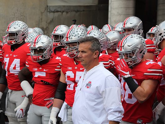OSU coach Urban Meyer stands with the Buckeyes before their game against Northwestern on Oct. 29, 2016 at Ohio Stadium. The Buckeyes won 24-20. Credit: Mason Swires | Assistant Photo Editor