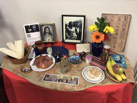 In traditional Mexican culture, family members create altars for dead loved ones with their favorite foods, flowers and pictures to honor them and their life. Credit: Elizabeth Suarez
