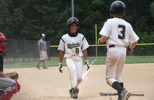 Noah West celebrates with Gavin Lyon following scoring a run during the two's days in Little League for the Westerville Warhawks. Credit: Courtesy of Carrie West