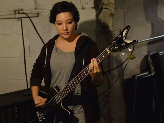 Allie Kauff plays bass for Inner Mikey. Credit: Adrien Lac | Lantern reporter