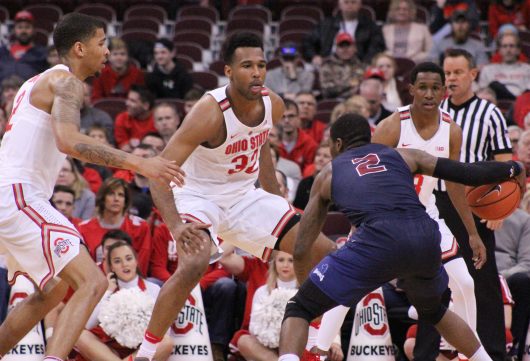 OSU senior forward Marc Loving (left), junior Trevor Thompson (middle) and sophomore guard C.J. Jackson defend Fairleigh Dickinson junior guard Darian Anderson in the Buckeyes win over the Knights.