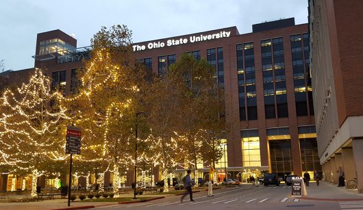 A student walks past the valet area outside Ohio State University Hospital on Nov. 30. Credit: Michael Huson | Managing Editor for Content